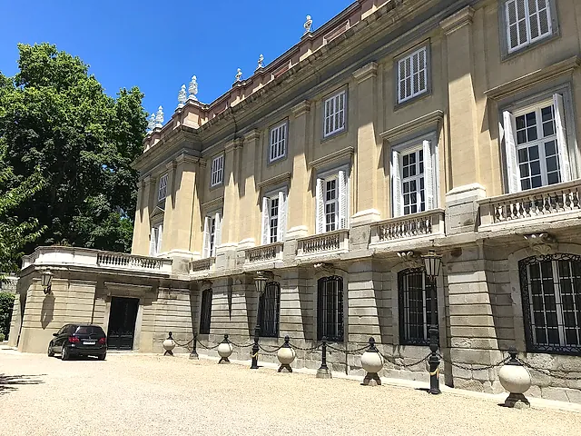 A corner of the Palacio de Liria, with its stone façade and balustrade seen from the courtyard