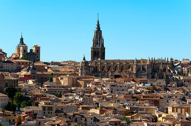 The rooftops of Toledo with the tall tower of the cathedral rising above them